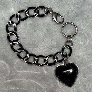 Black And silver Heart Pendant Dangle From Silver Tone Linked Bracelet